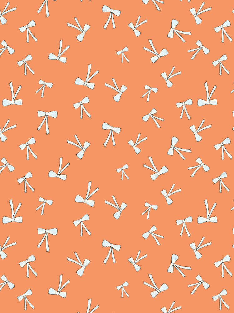 Scattered delicate ribbon bows in soft cream and blue on a warm coral background in a playful repeating pattern.