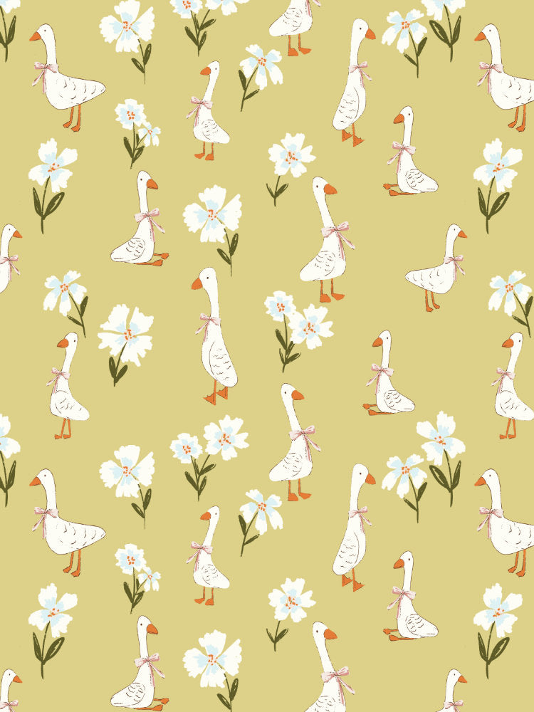 Playful repeating pattern of white geese with coral bows and delicate wildflowers on a warm ochre yellow background.