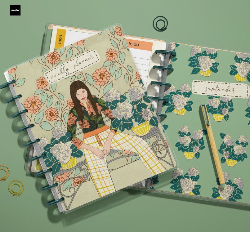 Floral-themed planner with a woman illustration on a green background